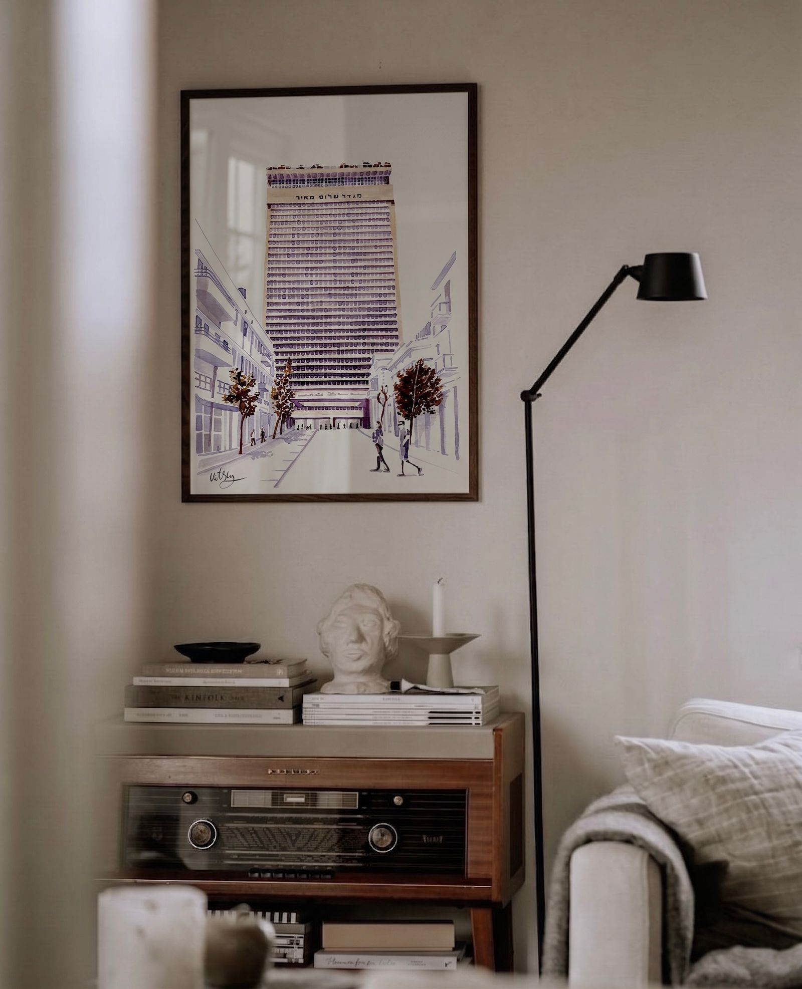 Framed Tel Aviv architecture print of Meir Shalom displayed in a refined neutral interior with hand-drawn AR artwork.